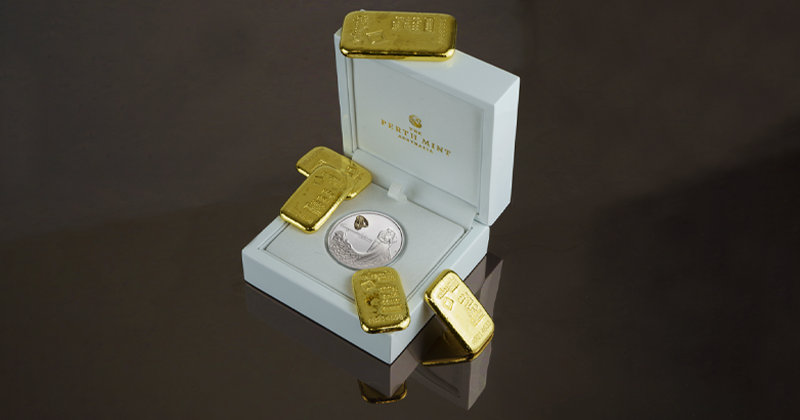 zelta monētas un stieņi