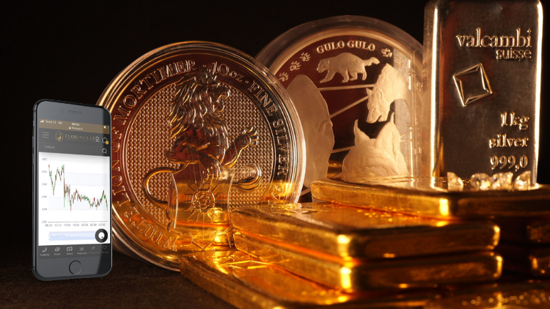 heap of precious metals with floring chart