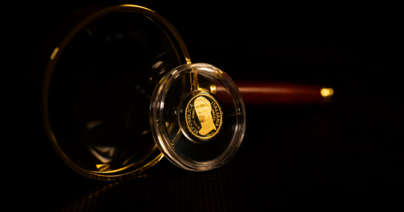 Magnifying glass that zooms into a gold coin